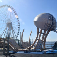 Child climbing on jellyfish-inspired play structure at Seattle’s Pier 58 playground