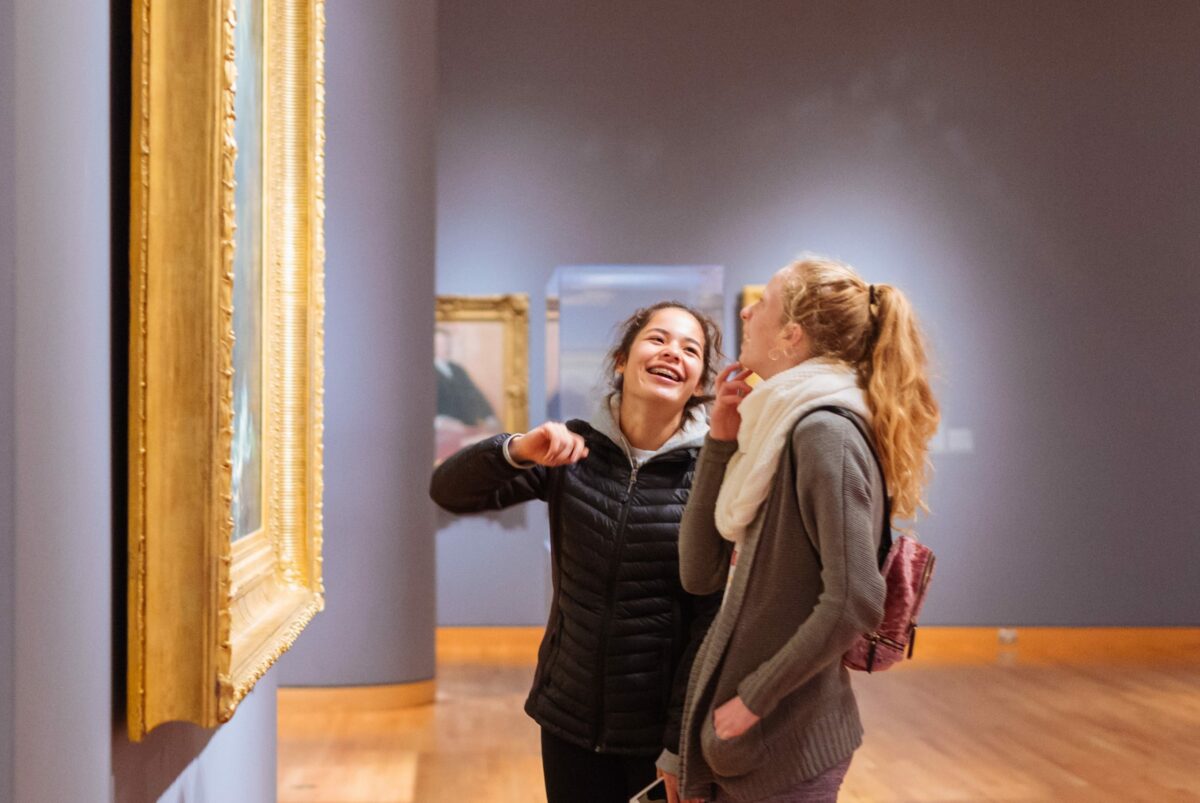 Two visitors laughing while viewing artwork at the Seattle Art Museum (SAM)