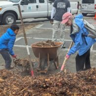 Kids and parents working together with shovels during Solid Ground’s Day of Service